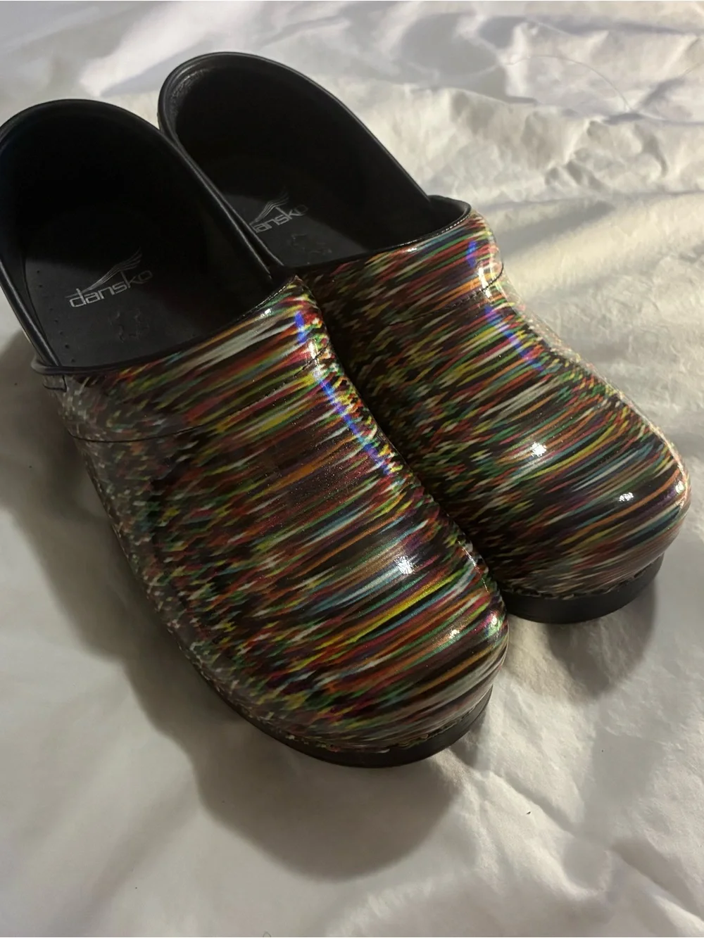 Dansko Multicolor Patent Slip-On Clogs with Rainbow Stripes - Picture 1 of 5